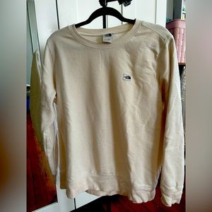 Women’s cream colored Northface sweatshirt